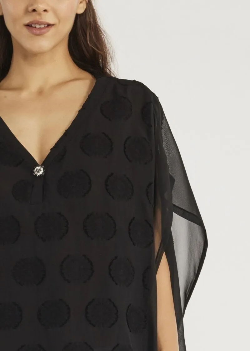 Blusa con bottone gioiello